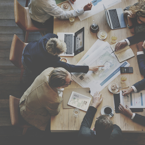 men and women in a meeting