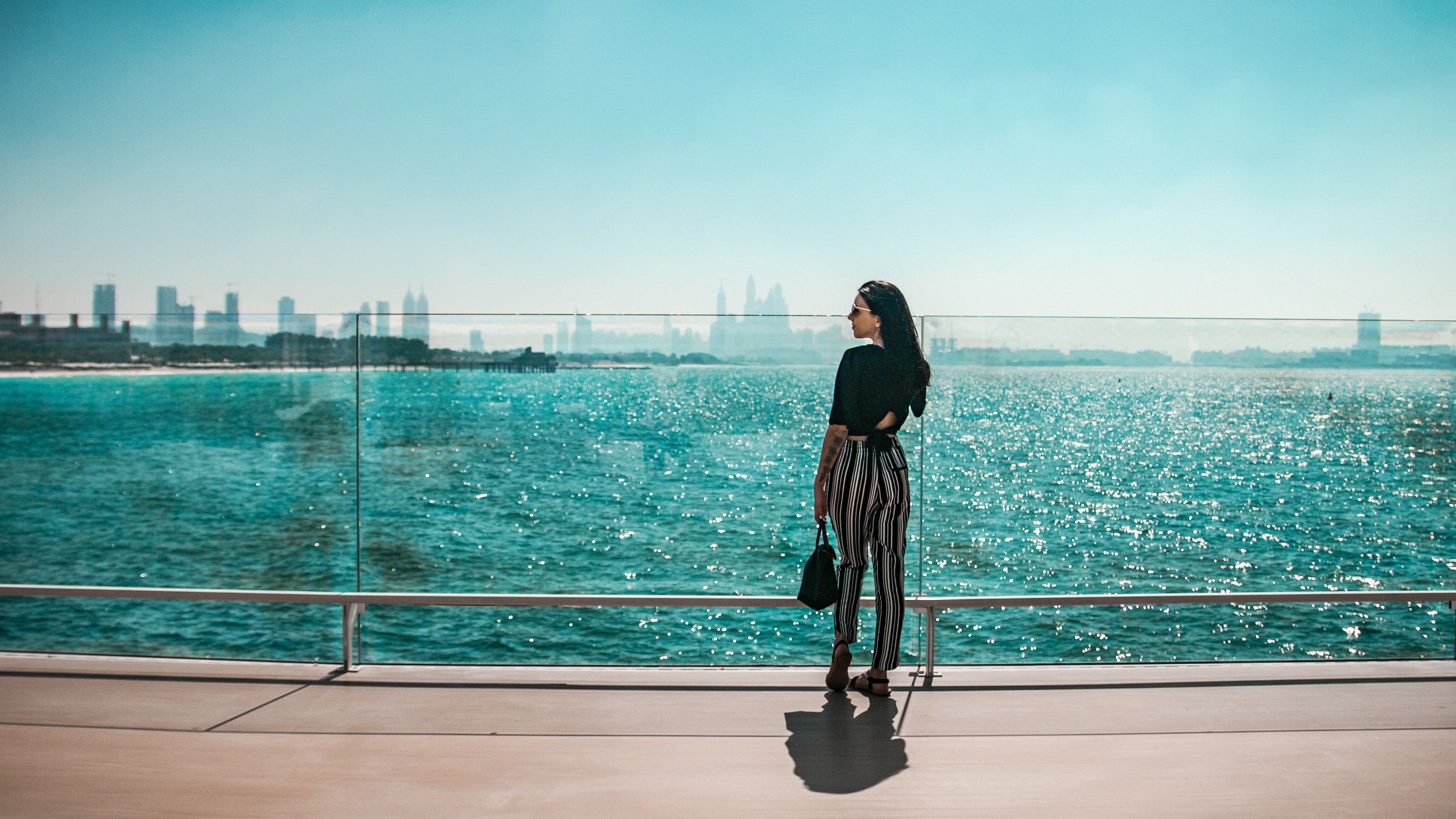 woman standing near a lake