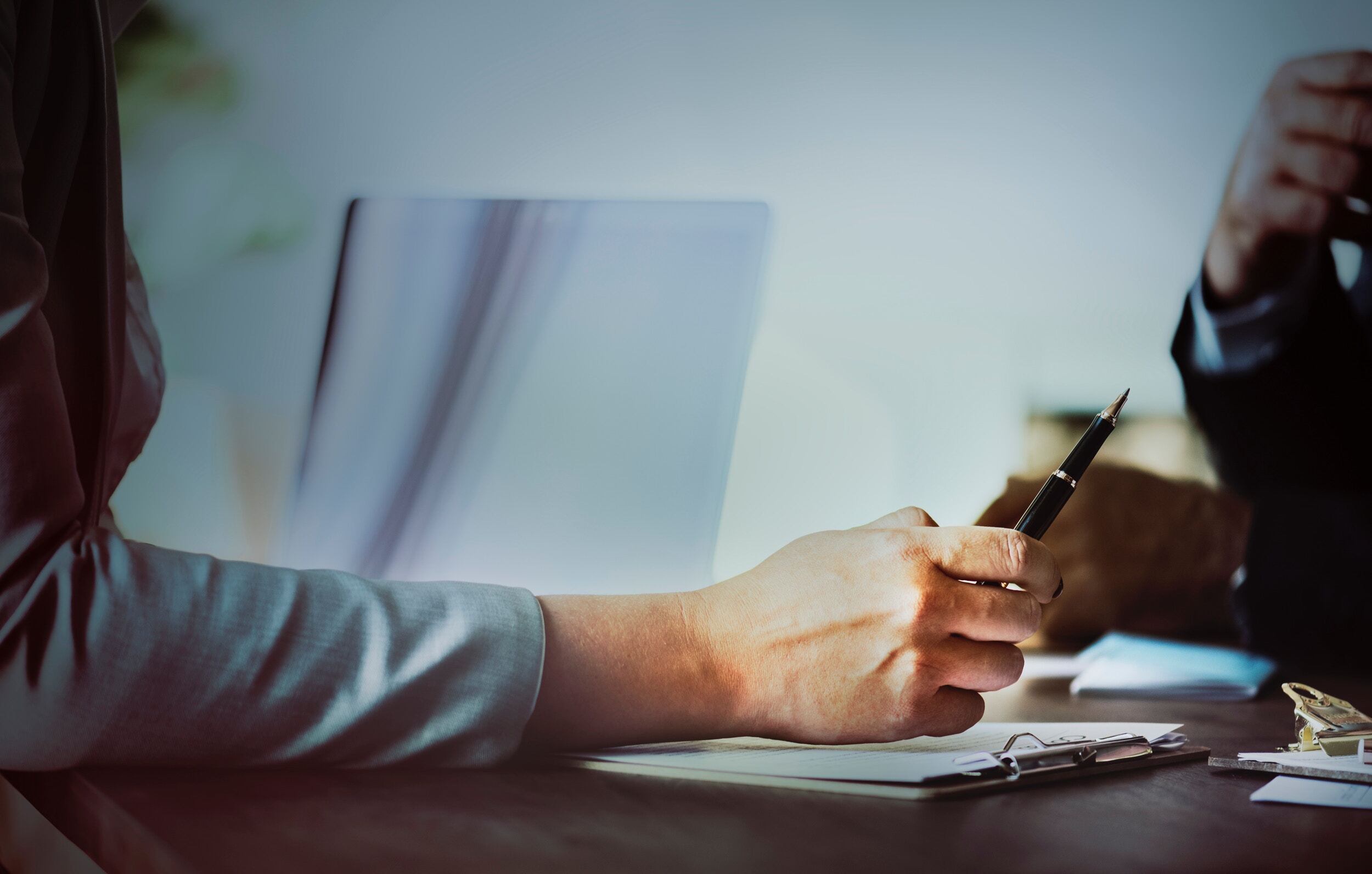 woman writing on paper