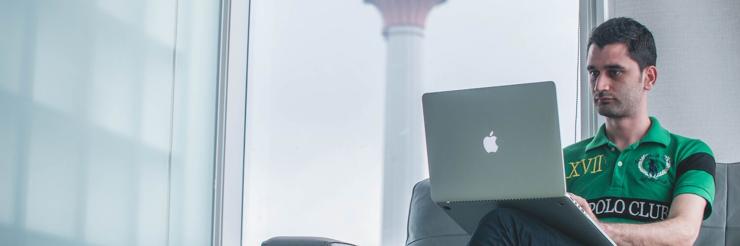 man sitting with laptop