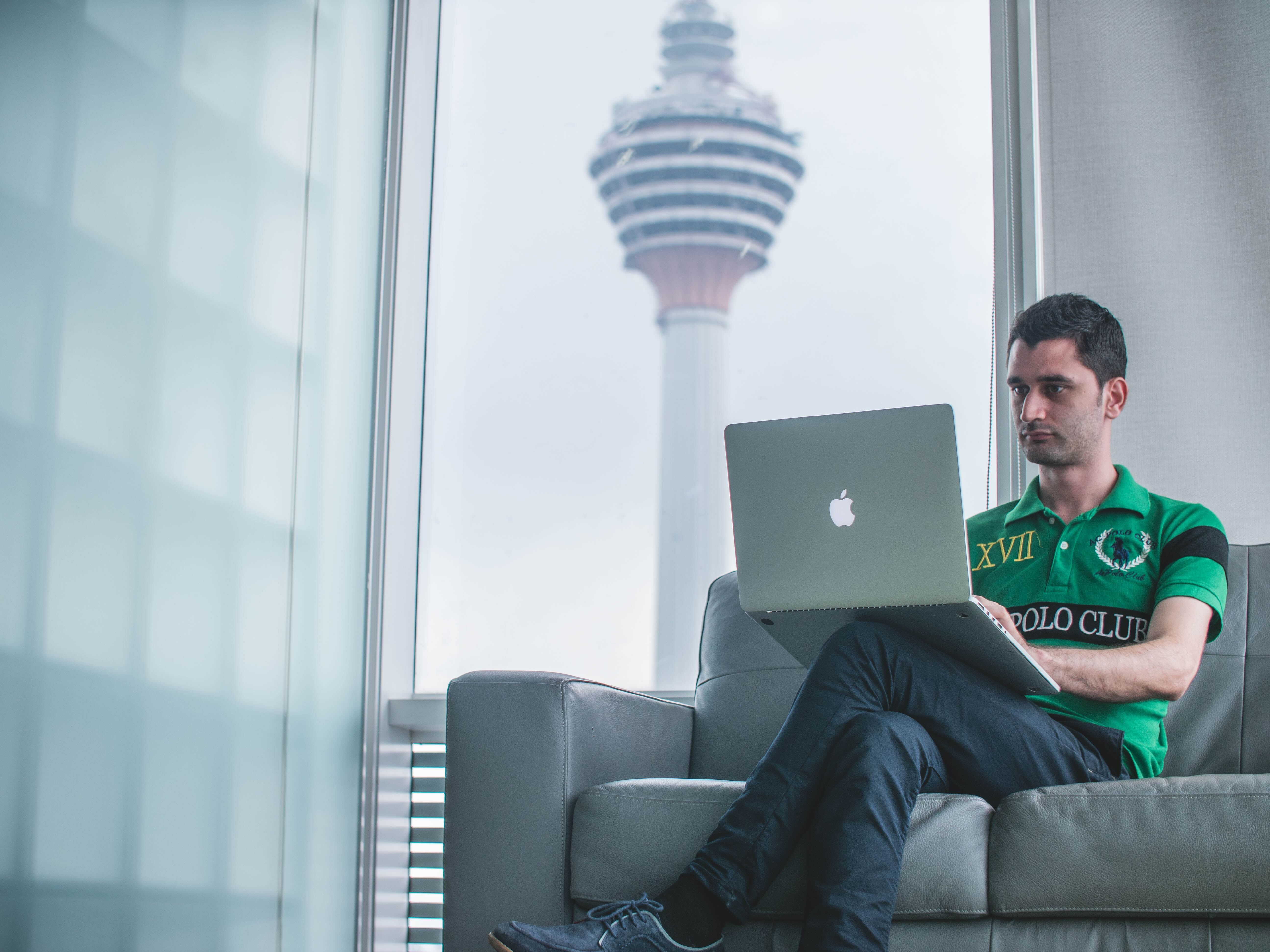 man sitting with laptop